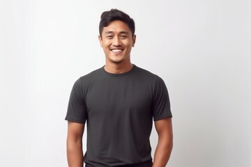 Obraz premium Portrait of handsome asian man in black t-shirt on white background