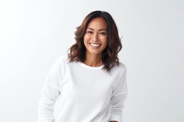 Obraz premium Portrait of a happy young asian woman standing against white background