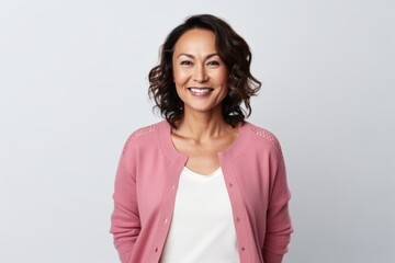 Fototapeta premium portrait of smiling middle aged woman in casual clothes looking at camera