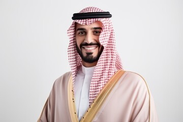 Obraz premium Portrait of a smiling arabian man standing over white background