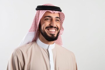 Portrait of a smiling arabian man on white background.
