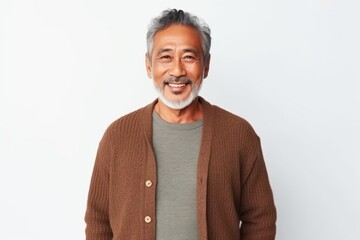 Fototapeta premium Medium shot portrait photography of a pleased Indonesian man in his 50s wearing a chic cardigan against a white background 