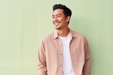 Medium shot portrait photography of a pleased Indonesian man in his 30s wearing a chic cardigan...