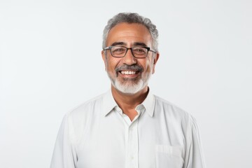Portrait of Indian senior man with eyeglasses on white background.