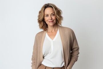 Lifestyle portrait photography of a satisfied Russian woman in her 40s wearing a chic cardigan against a white background 