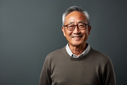 Portrait of a smiling senior asian man wearing eyeglasses