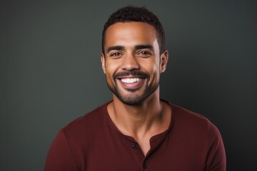 Fototapeta premium Portrait of a handsome african american man smiling at camera