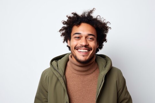 Portrait of a happy young african american man smiling over white background
