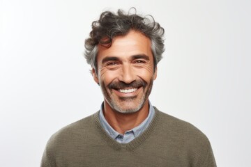 Fototapeta premium Portrait of a smiling middle-aged man looking at the camera over white background