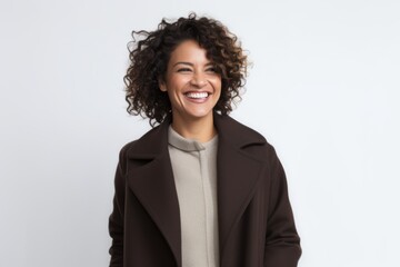 Portrait of happy african american woman smiling and looking at camera over white background