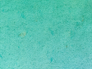 Closeup of the turquoise blue stone wall surface in an area of ​​the house