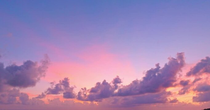 aerial view beautiful purple cloud in pink sky at horizon above the sea..Clouds obscured the pink sky in the evening background for creative nature .and travel concept. sky texture.