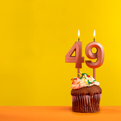 Number 49 birthday candle - Celebration on yellow background