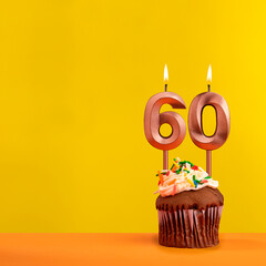 Candle with flame number 60 - Birthday card on yellow background