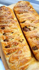Delicious homemade banana strudel. Butter crispy pastry skin that wraps banana pieces inside.