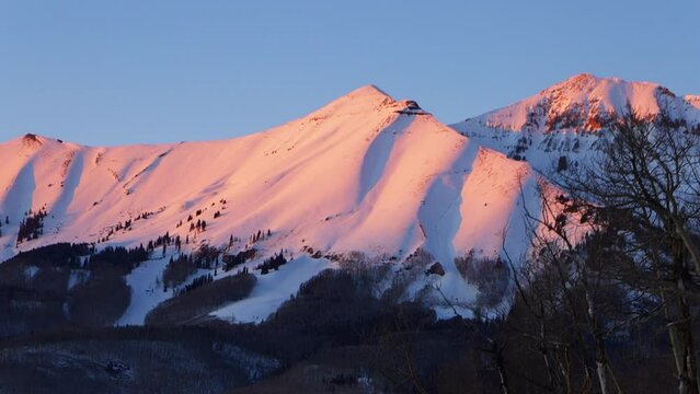 Winter fresh snowfall sunset gondola ride Telluride ski resort winter Rocky Mountains Ouray Silverton 14er Mt Sneffels Dallas Peaks Southern Colorado most scenic mountain landscape view cine pan