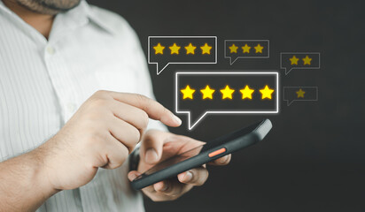 Customer service and satisfaction concept. Client man choosing 5-star icon to give satisfaction in service for evaluation product service quality, feedback review, good quality.