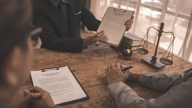 Full concentration at work. correctly sign contracts with clients, Sign and Execute Binding Contracts, contracts jargon, legal terms and definitions, signed by unauthorised person