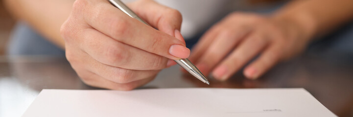 Woman signs contract or agreement close-up. - obrazy, fototapety, plakaty