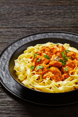 Creamy Paprika Pork Chunks over tagliatelle noodle