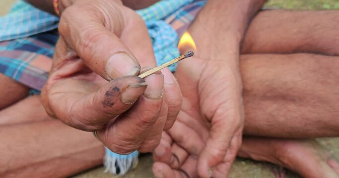 Indian Village man taking or smoking Chilum(Marijuana, Cannabis.