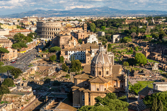 Aerial view of the Roman Forum, including the Curia Julia and the Colosseum, as seen from the top of the vitt