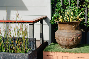 Terracotta pots placed in a small corner in the garden.