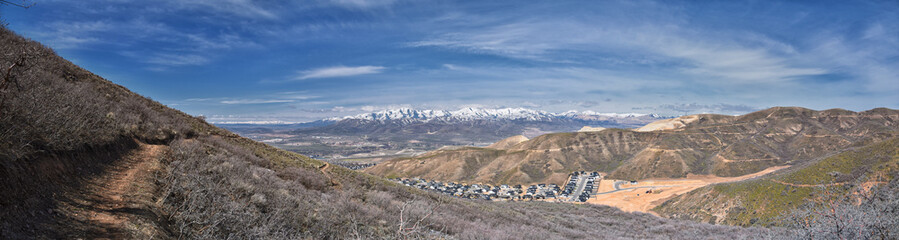 Salt Lake and Utah County Valley views from Sensei Lolo loop trail snowy mountain valley in Lone Peak Wilderness Wasatch Rocky Mountains, Utah. USA. 