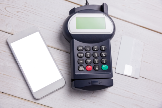 Digital png photo of payment terminal, smartphone and credit card on transparent background - Powered by Adobe