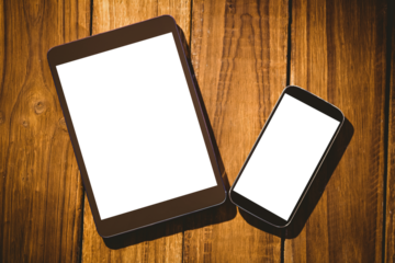 Digital png illustration of tablet and smartphone on wood on transparent background