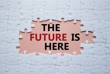 The future is here symbol. Concept words The future is here on white puzzle. Beautiful pink background. Business and The future is here concept. Copy space.