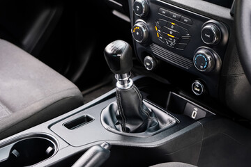 automatic transmission shift selector in the car interior. Closeup a manual shift of modern car gear shifter. 4x4 gear shift