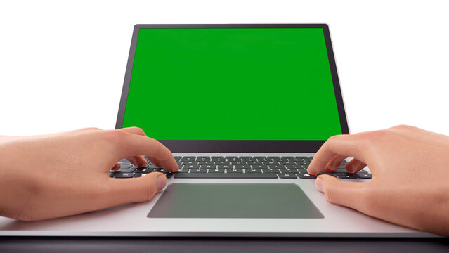 3d hand typing on laptop with green screen monitor display.