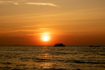sea with boats in the evening