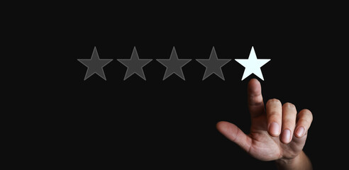 finger pointing to a star - 5 star rating concept