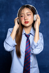 Beautiful Asian woman in school uniform taking a photo of yearbook trend. American yearbook trend...