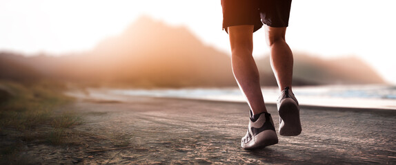 man running marathon on the beach shore concept of doing sport and health care