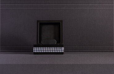 Podium on a dark gray background. Product display. Mockup for product branding, presentation. Background for products, cosmetics, jewelry.