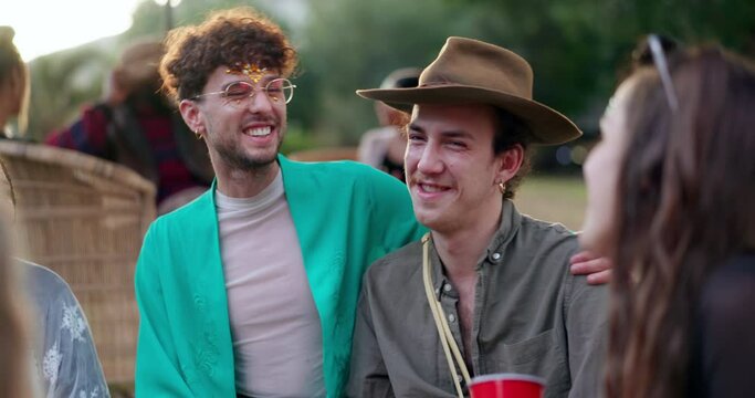 Friends at music festival with lgbt, hug and happiness, freedom and fun at outdoor concert with diversity. Happy event, pride camp and gay couple at picnic in park, men and women in summer together.