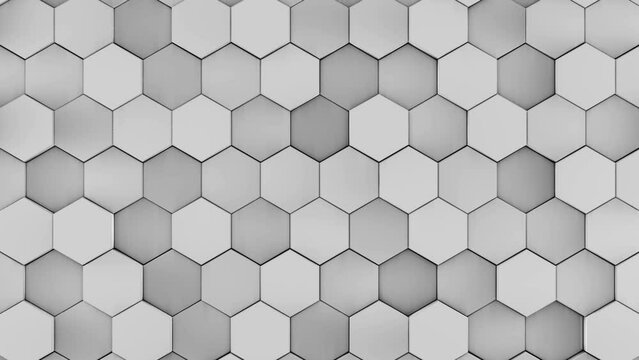 Computer graphics background. A honeycomb network of hexagons in different shades of gray. Colors change and move. The effect of movement of the entire network