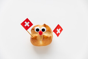 The first august bread baked to celebrate the national holiday of Switzerland. Funny face with wobbly eyes.