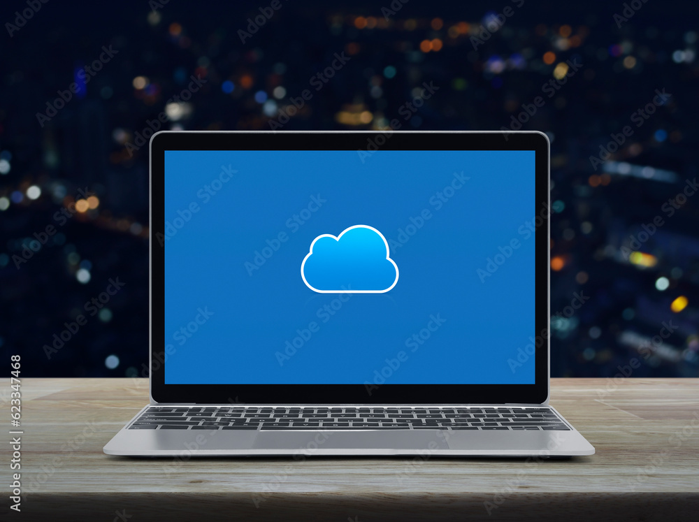 Poster cloud computing icon on modern laptop computer monitor screen on wooden table over blur colorful nig