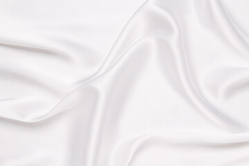 Elegance white satin silk with waves, abstract background luxury cloth, elegant wallpaper design. Abstract background luxury cloth or liquid wave