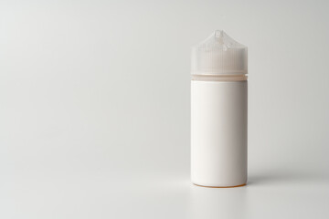 Refill liquid for electronic cigarettes on gray background