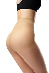 Legs of slim woman in tights on white background