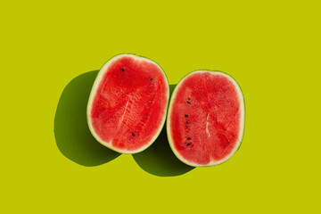 Fresh watermelon on green background.