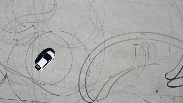 Aerial view of white car after drifting