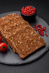 Delicious fresh crispy brown bread with seeds and grains cut into slices