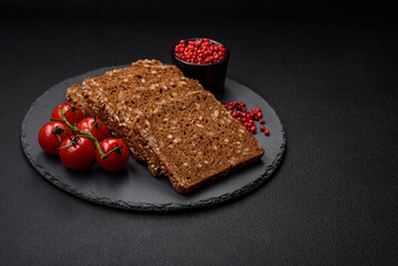 Delicious fresh crispy brown bread with seeds and grains cut into slices