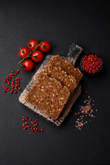 Delicious fresh crispy brown bread with seeds and grains cut into slices
